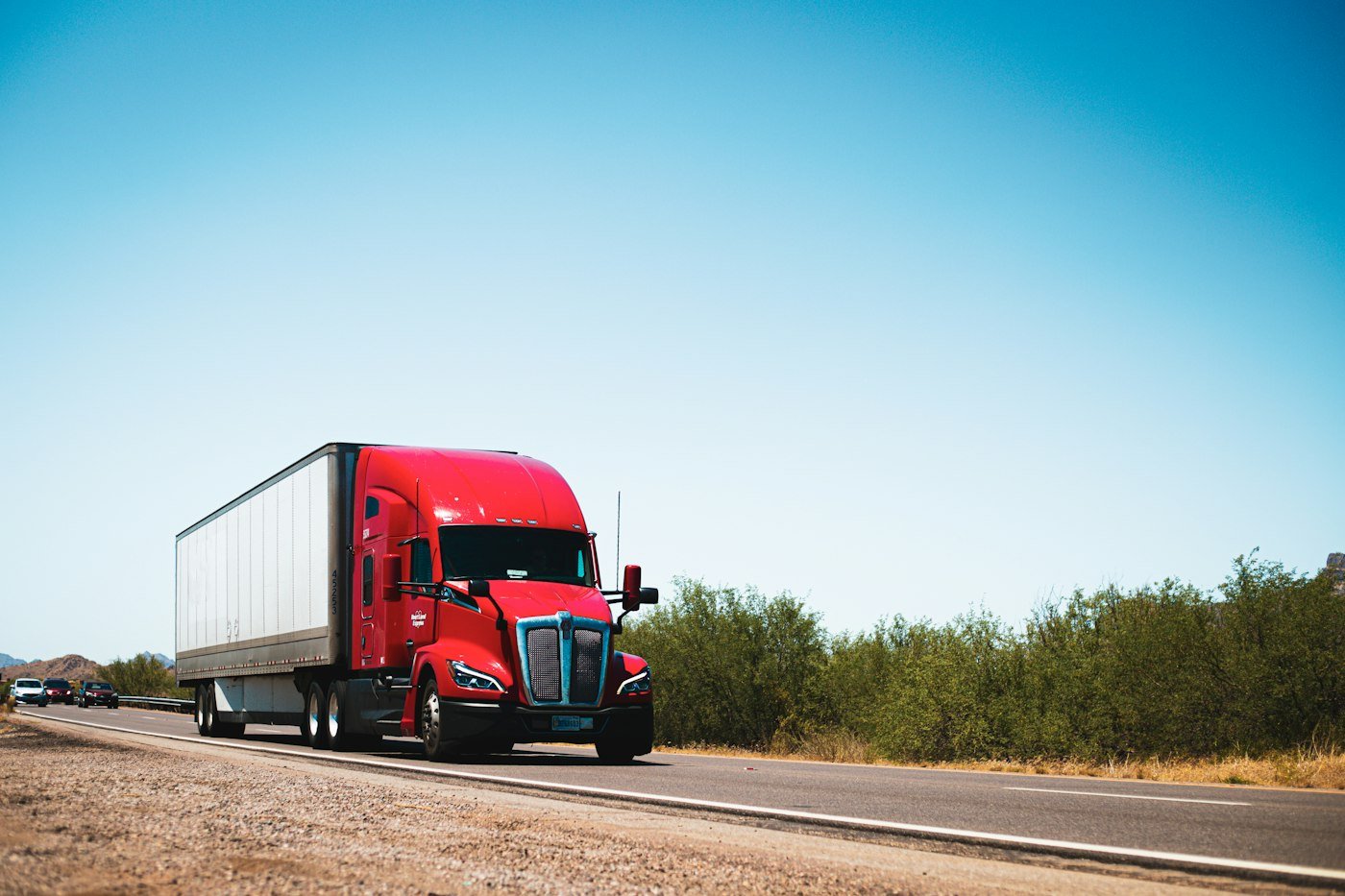 Tractor-trailer on the highway under open sky